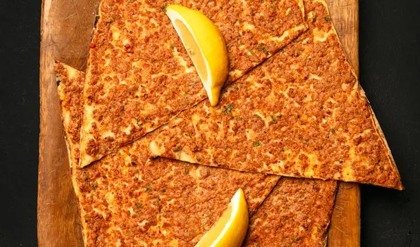 Lahmajo cut into slices with lemon