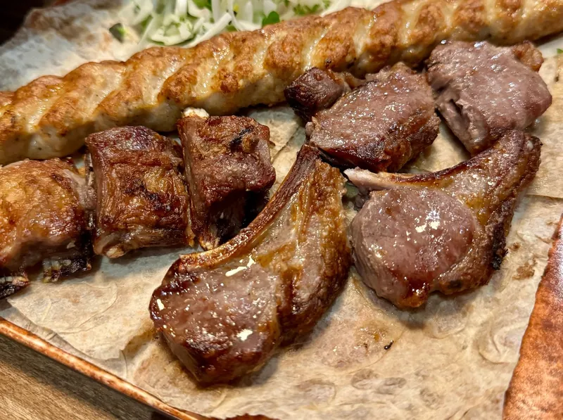Lamb chops, pork and kebab from the mangal on lavash